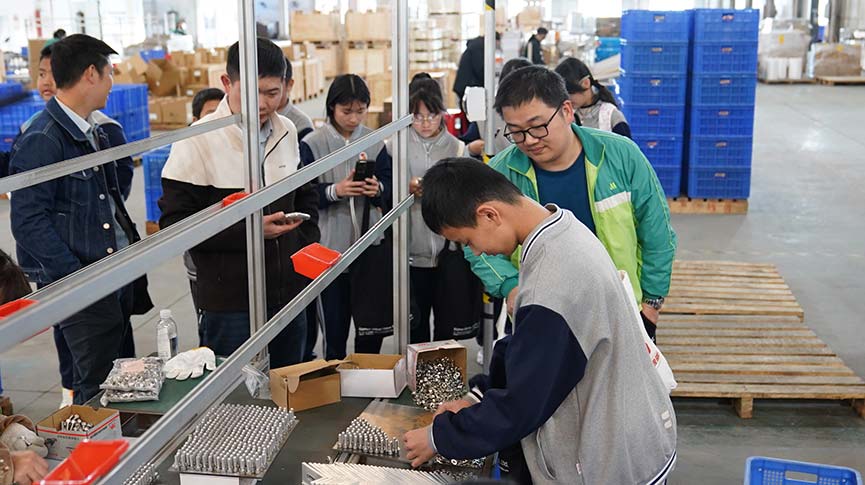 Student participates in hands-on assembly of components during the Mibet Energy tour